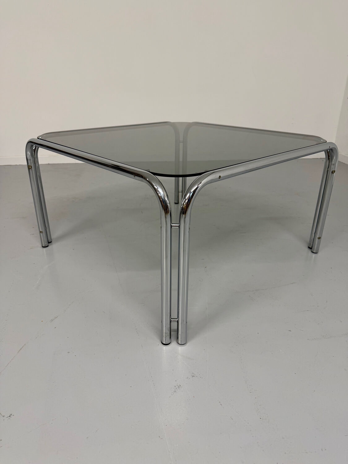 Space coffee table from the 70s, tubular metal and vintage smoked glass