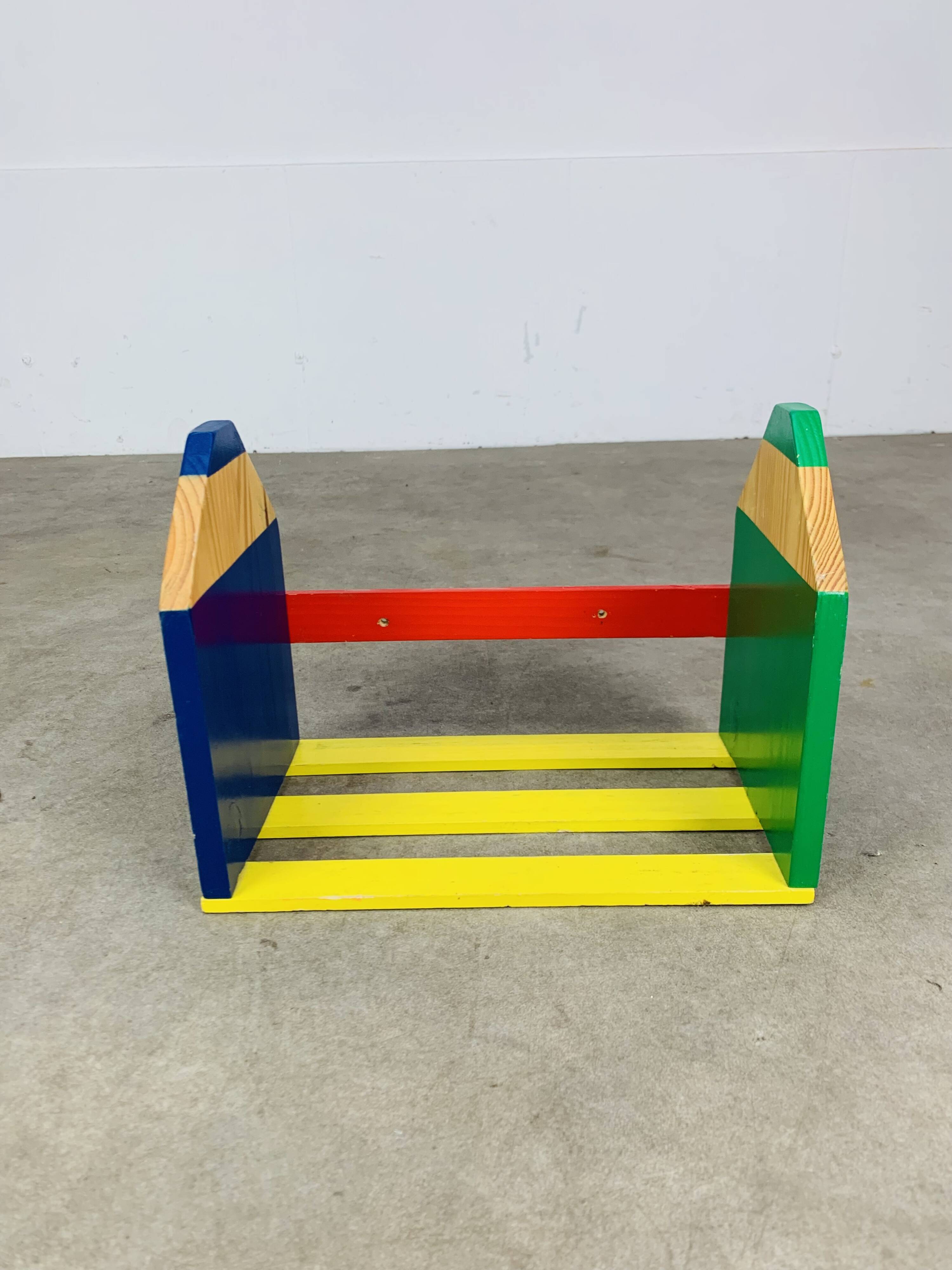 Wall-mounted pencil shelf for children, Pierre Sala style.