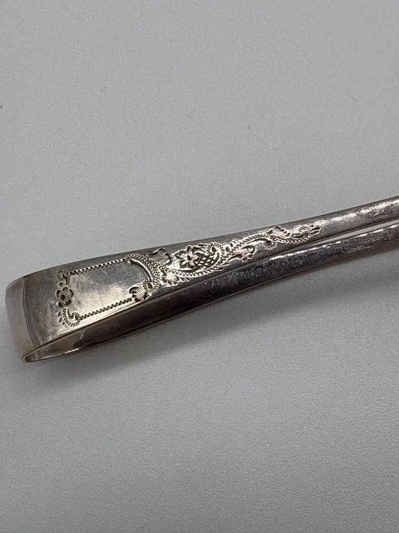 Service of 12 silver-plated metal coffee spoons with tongs and box from around 1900.