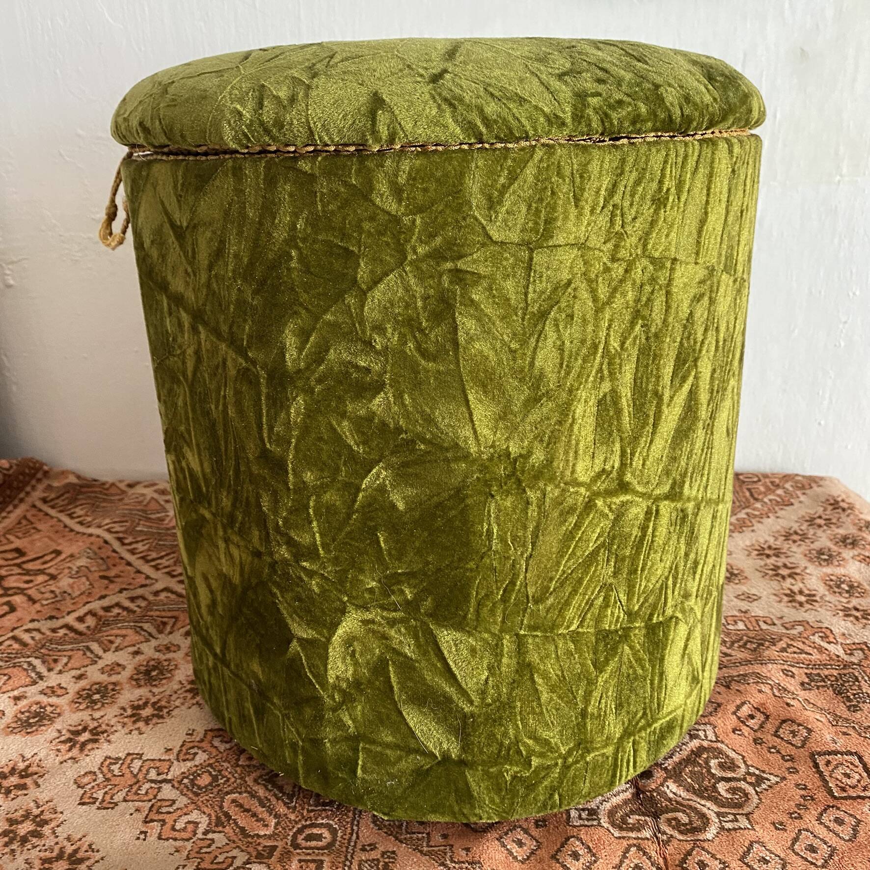 Green velvet storage pouffe from the 1960s.