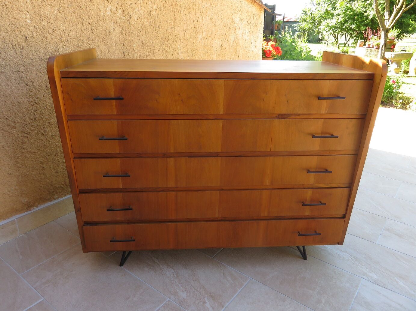 Teak chest of drawers and metal compass feet