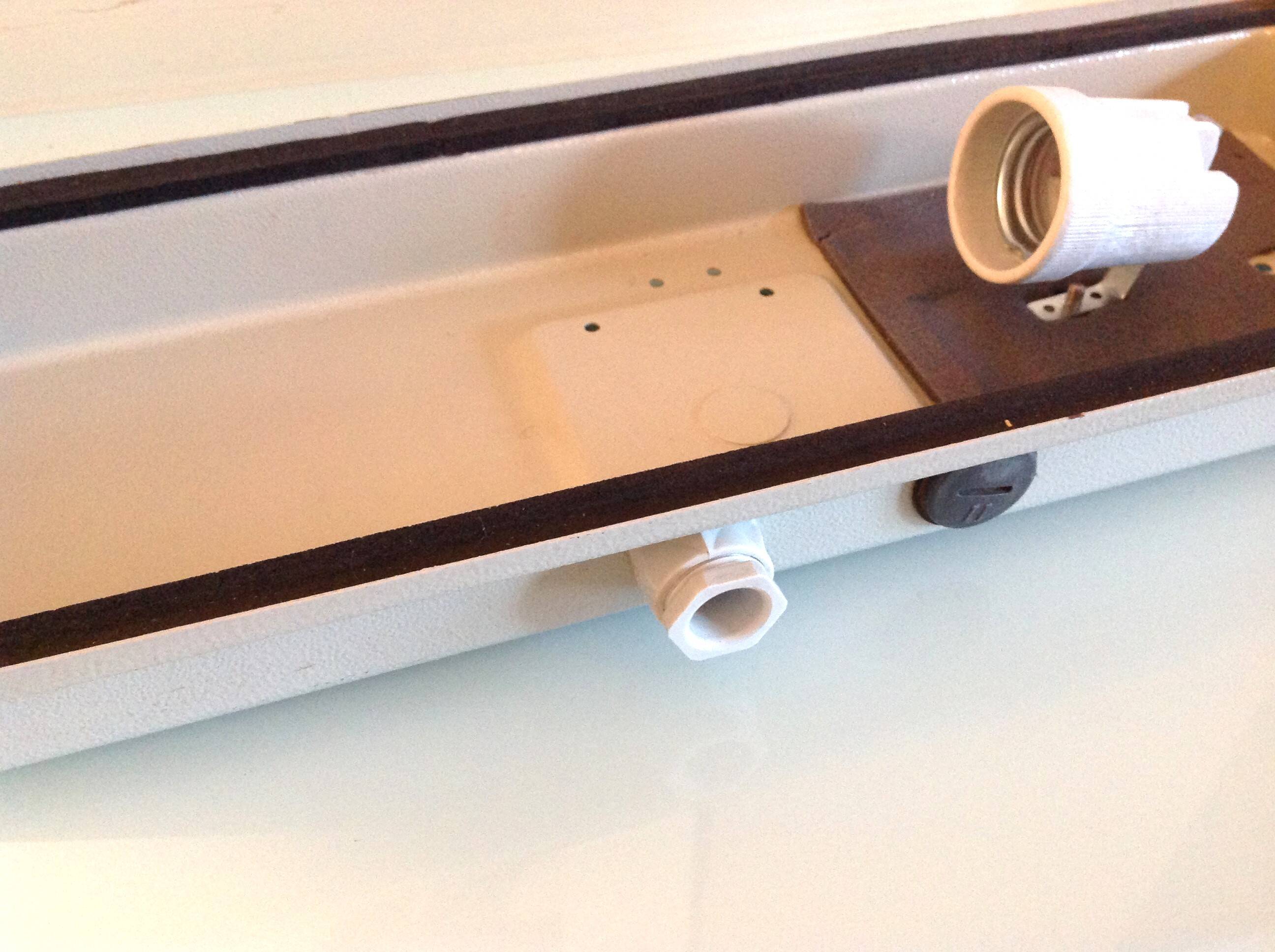 Rectangular porthole wall light in industrial/70s style frosted glass