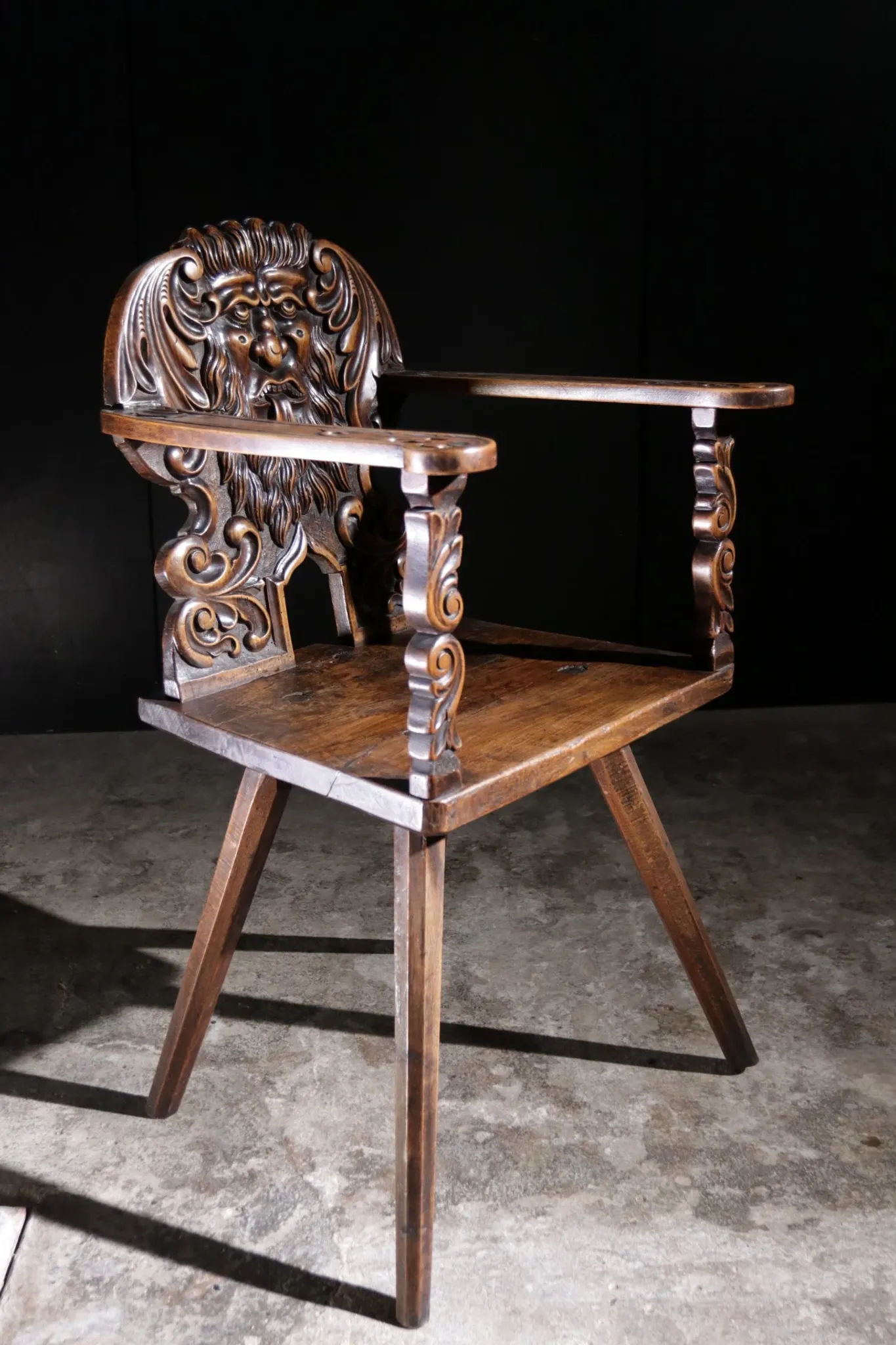 17th century Alpine carved walnut Brettstuhl armchair with grotesque mask