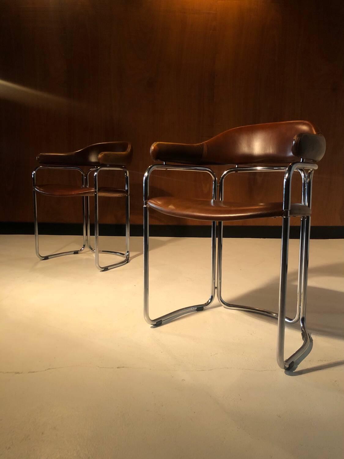 Pair of vintage armchairs, cognac leather and chrome steel 1970