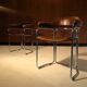 Pair of vintage armchairs, cognac leather and chrome steel 1970