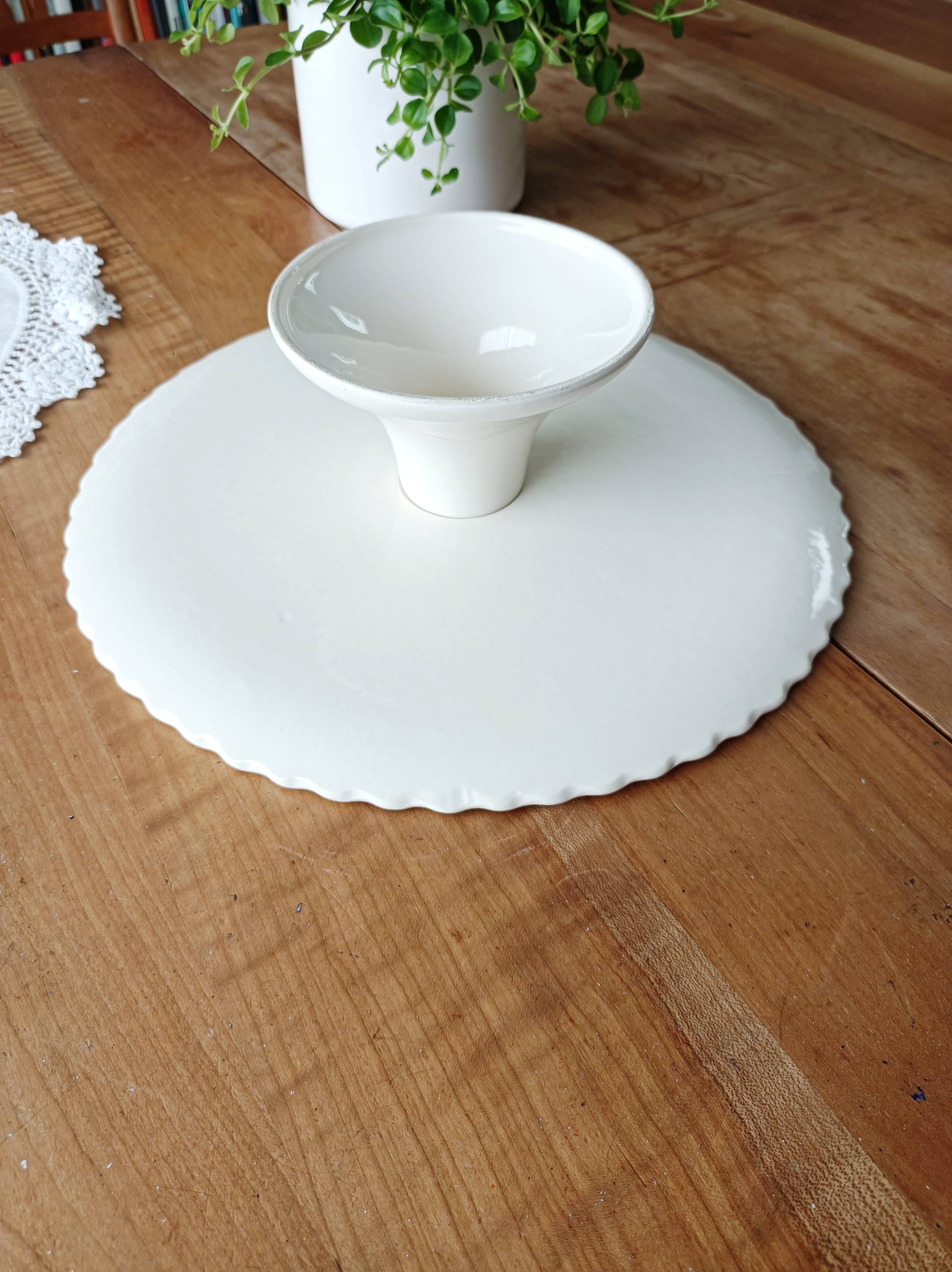 Pie dish on foot, in slip with blackberry decoration