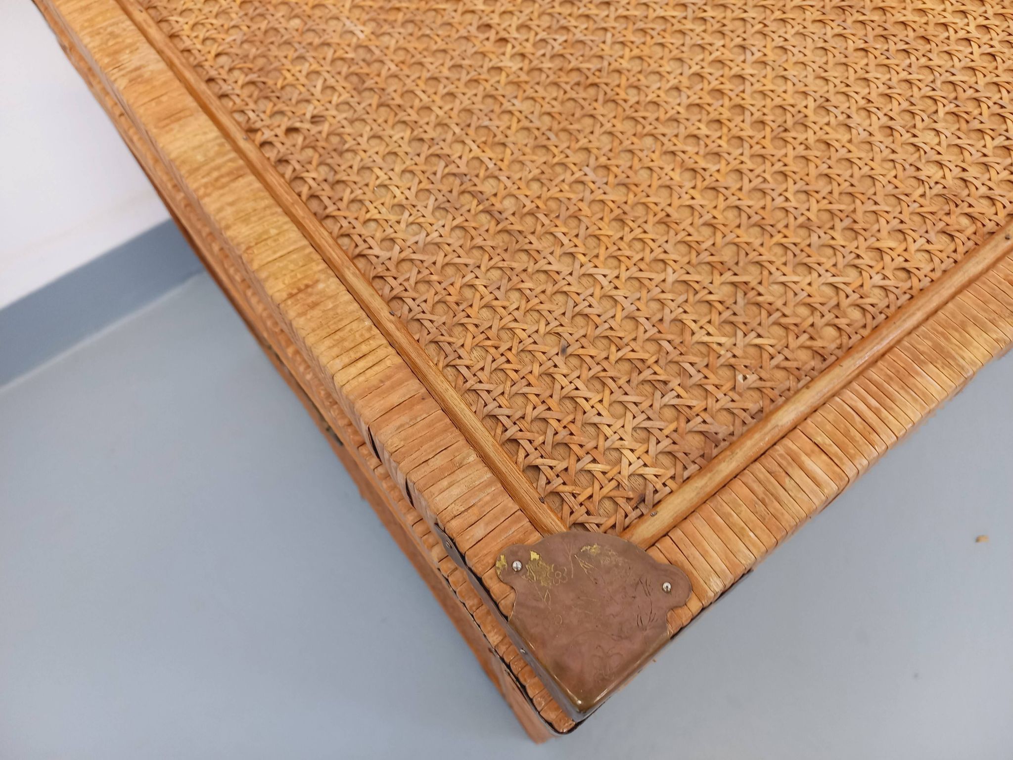 Vintage trunk in wood, rattan, caning, and brass.