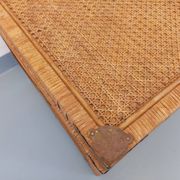 Vintage trunk in wood, rattan, caning, and brass.