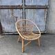 Vintage 1960s rattan shell chair – an icon of bohemian design.