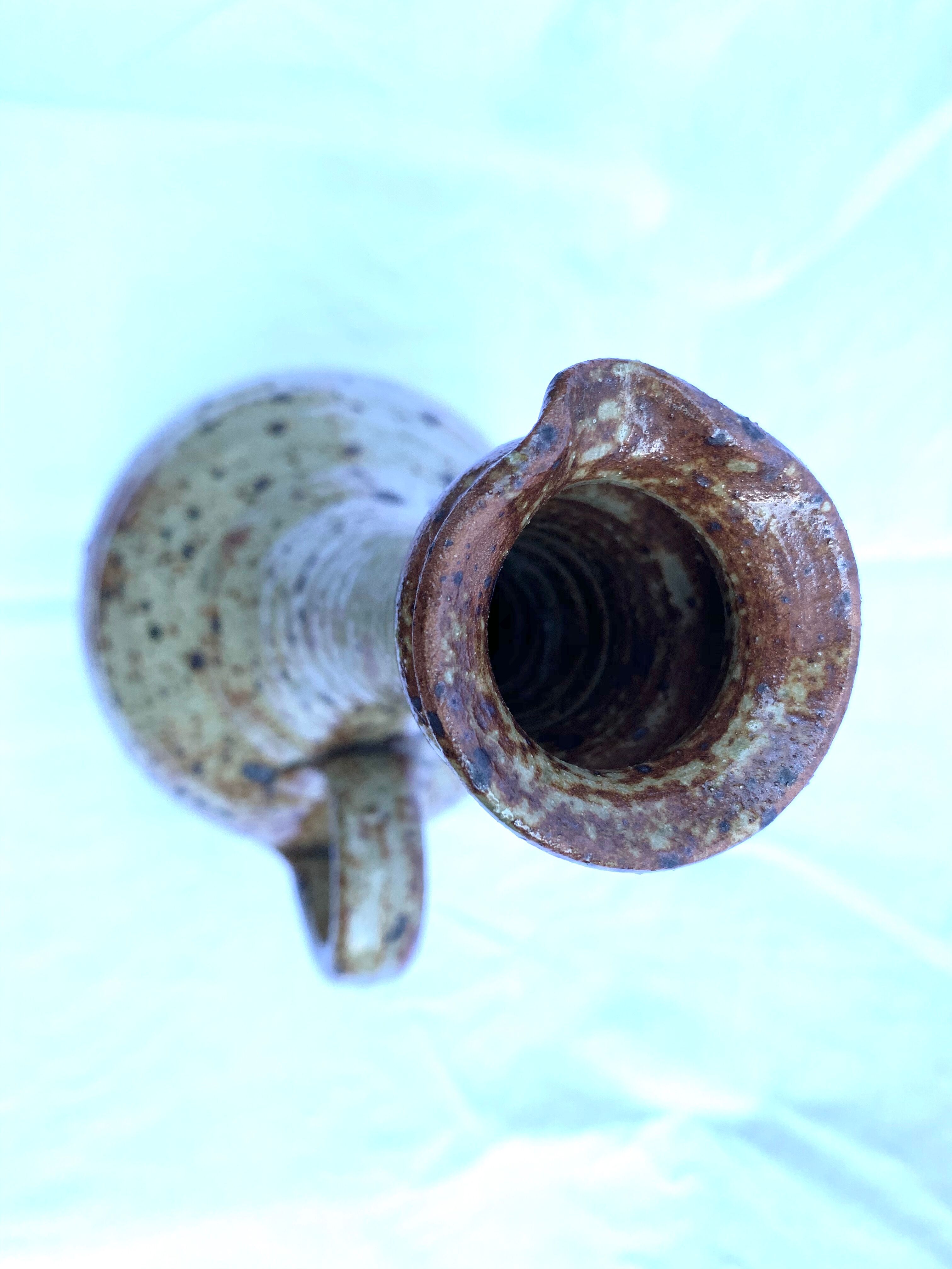 Speckled enamelled sandstone pitcher