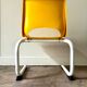 Children's chair in white metal and yellow plastic