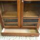Old school glass bookcase in blond wood