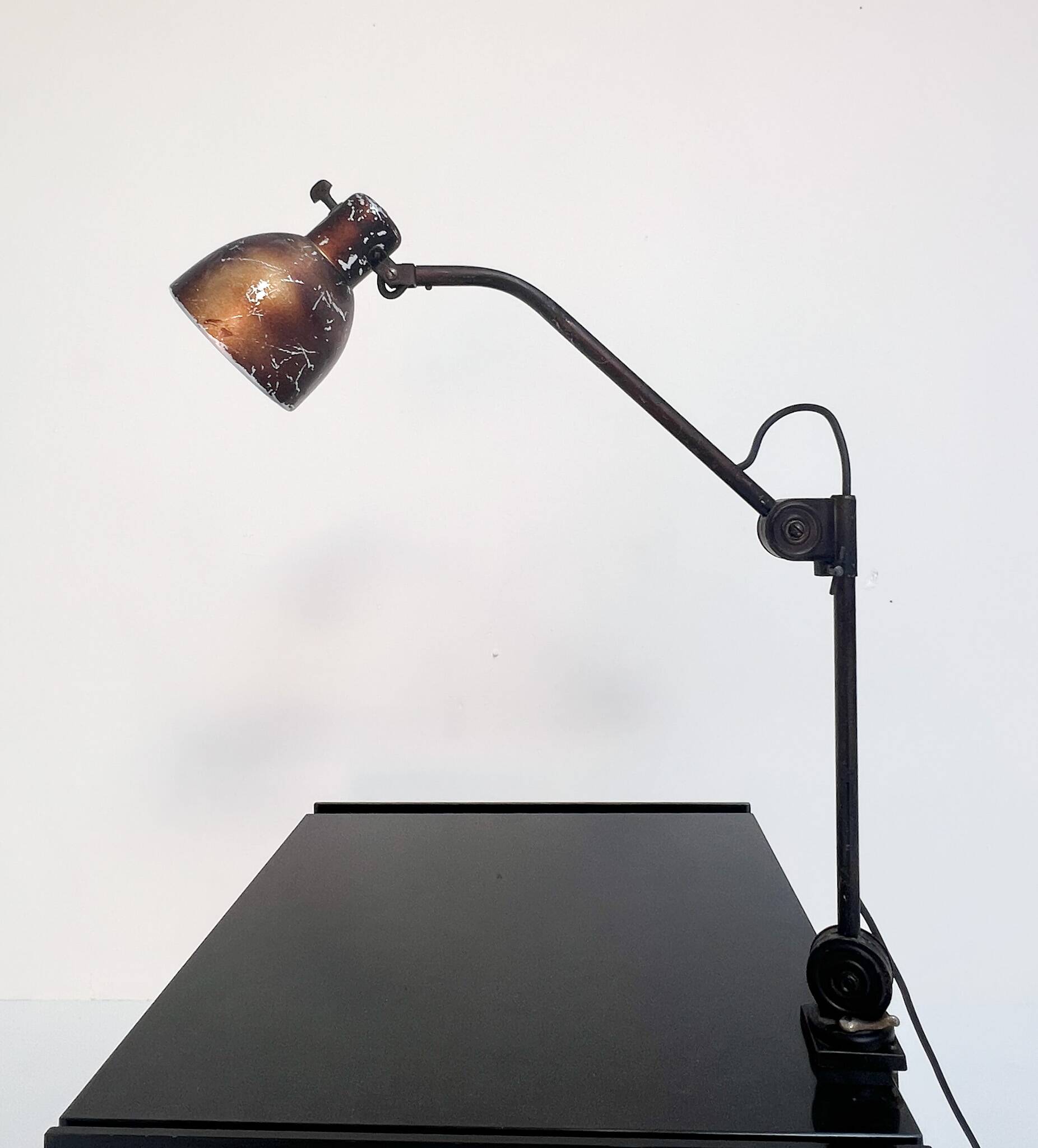 Industrial in height to be adjusted vintage clamp lamp from the 1970s