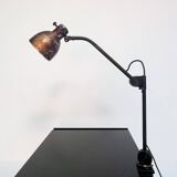 Industrial in height to be adjusted vintage clamp lamp from the 1970s
