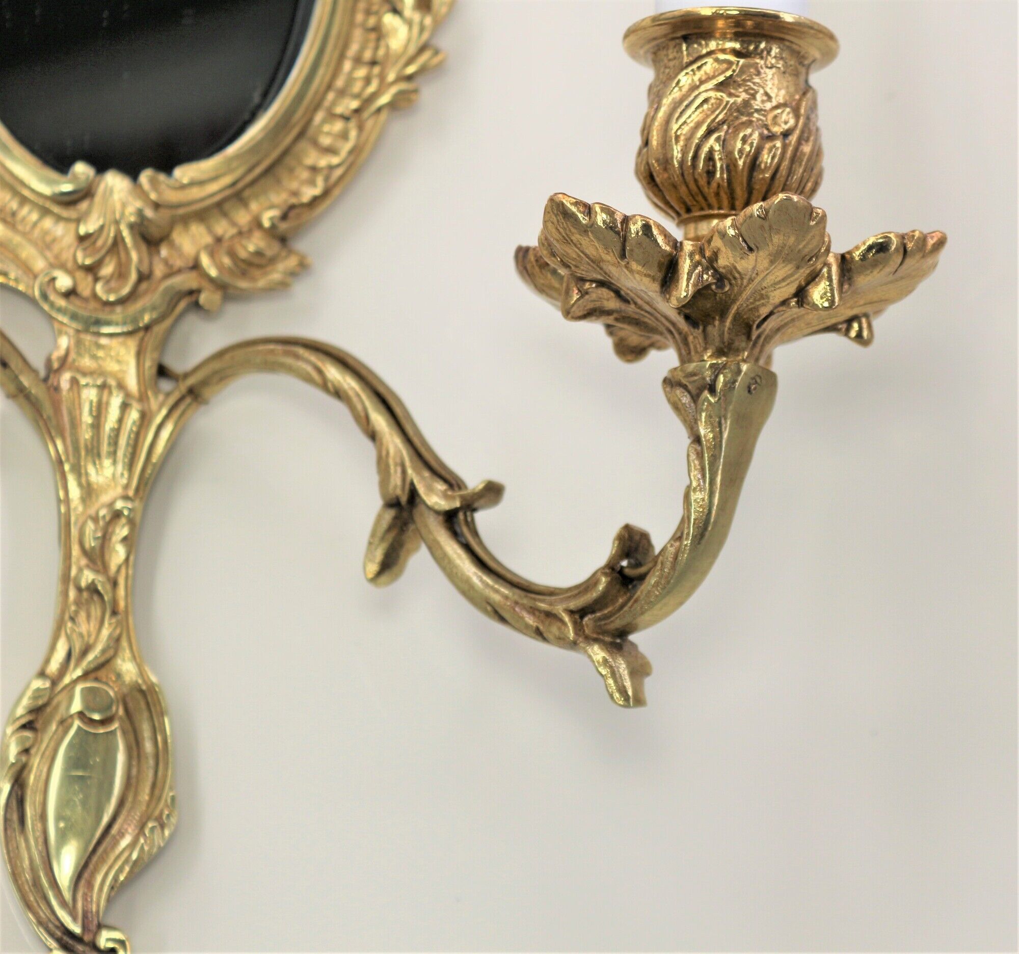 Pair of louis XV beveled mirror wall lamps in bronze by "Lucien Gau"
