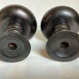 Pair of black stained wooden candlesticks