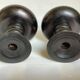 Pair of black stained wooden candlesticks