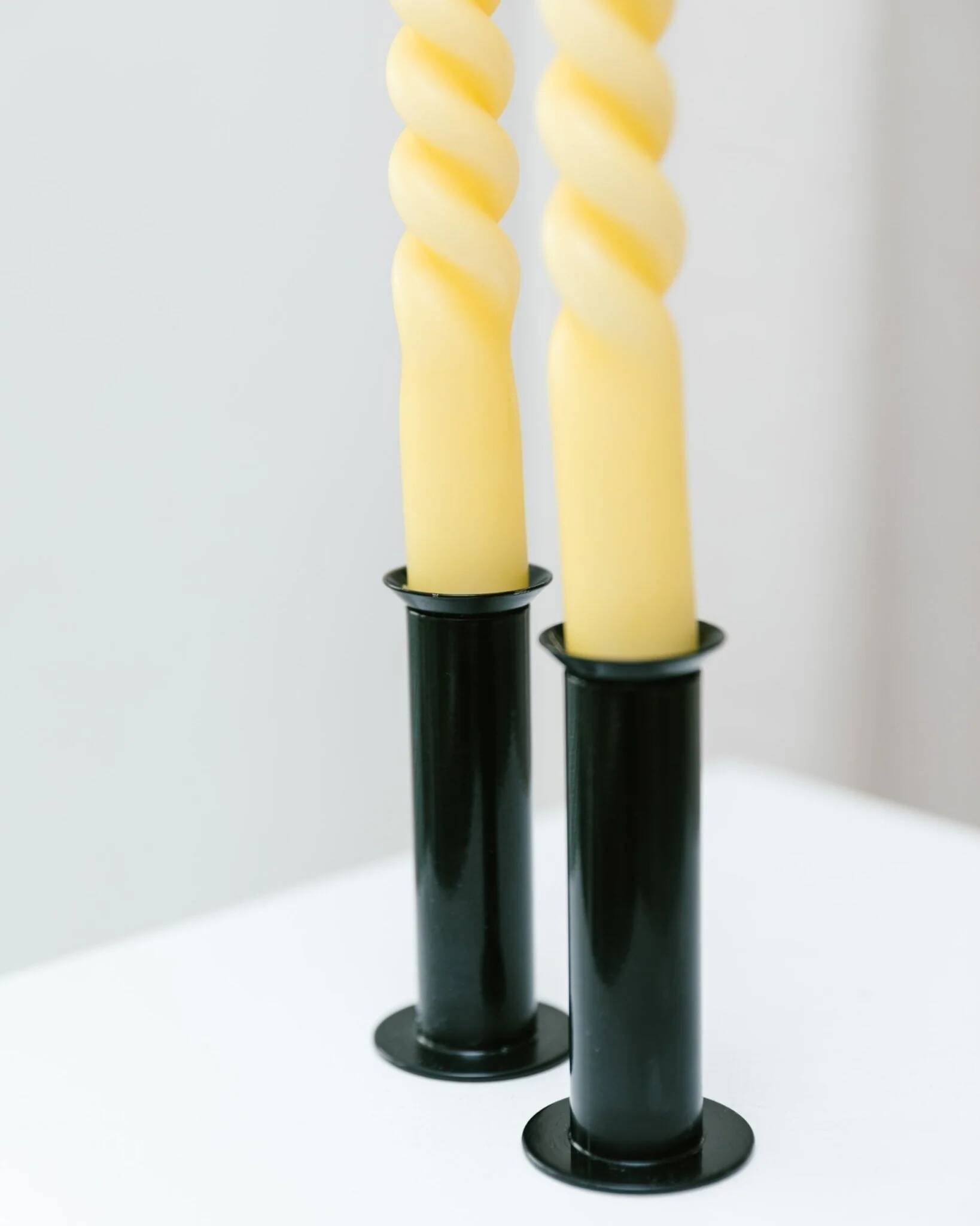Set of 2 glossy black metal candleholders in retro Ikea Memphis style