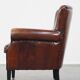 Sheepskin armchair/lounge chair finished with decorative nailheads