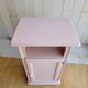 Antique bedside table revamped in pink.