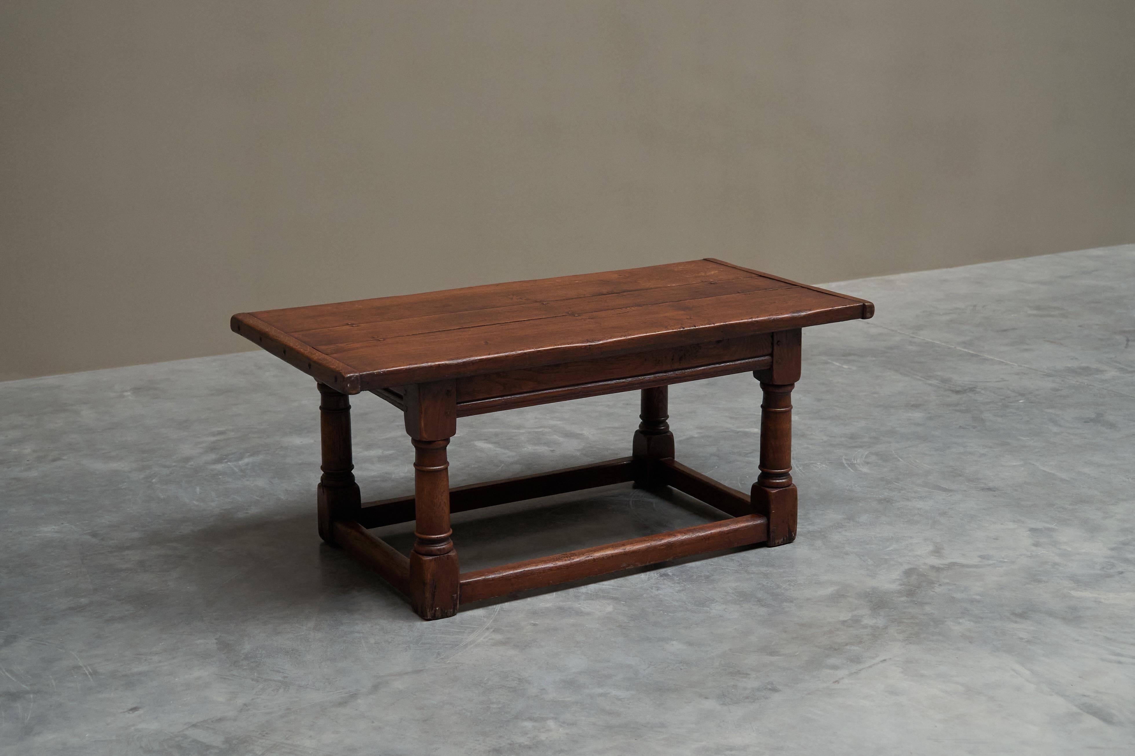 Antique solid oak coffee table in refectory style, 19th century.