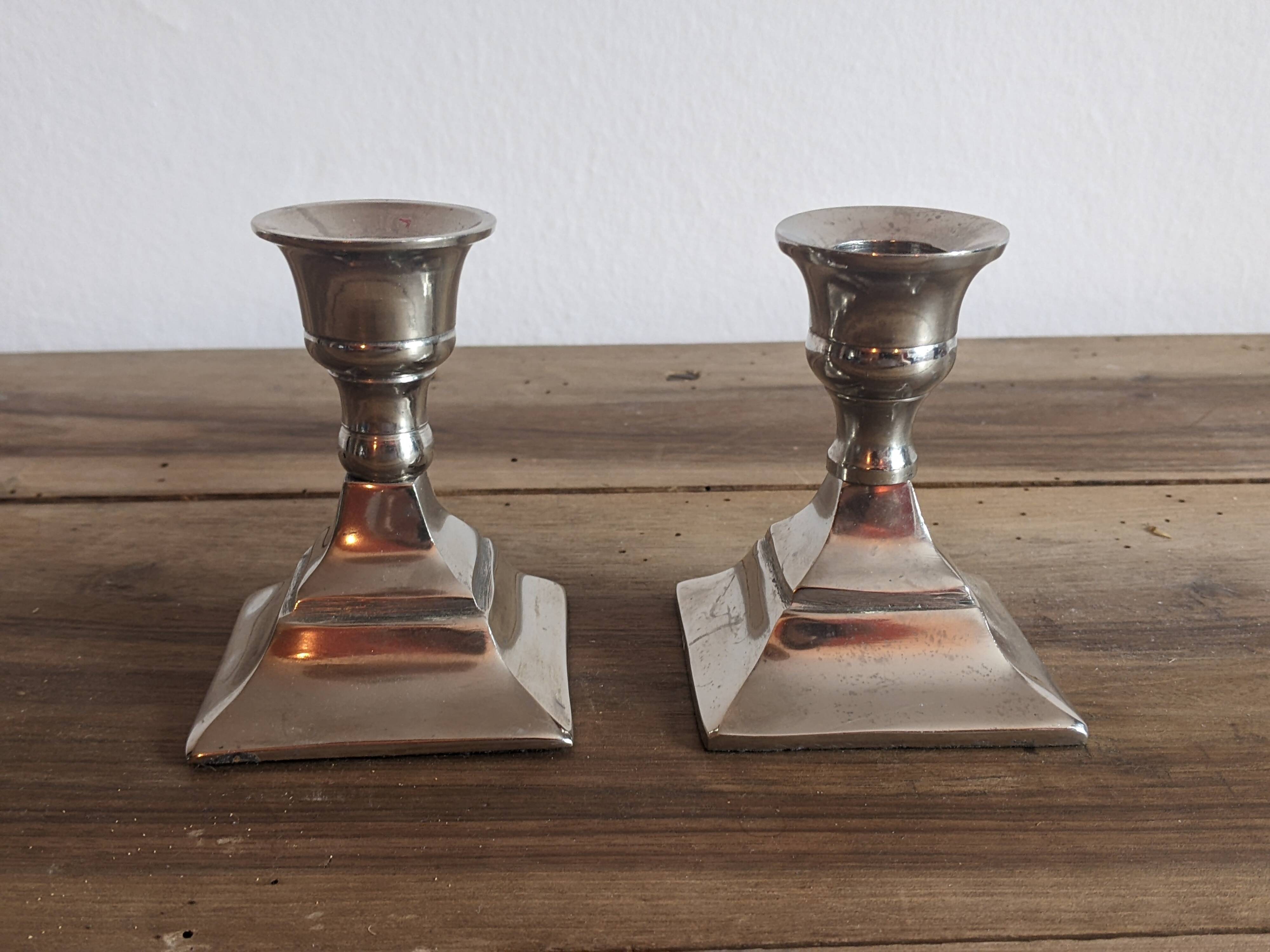 Pair of silver metal candlesticks