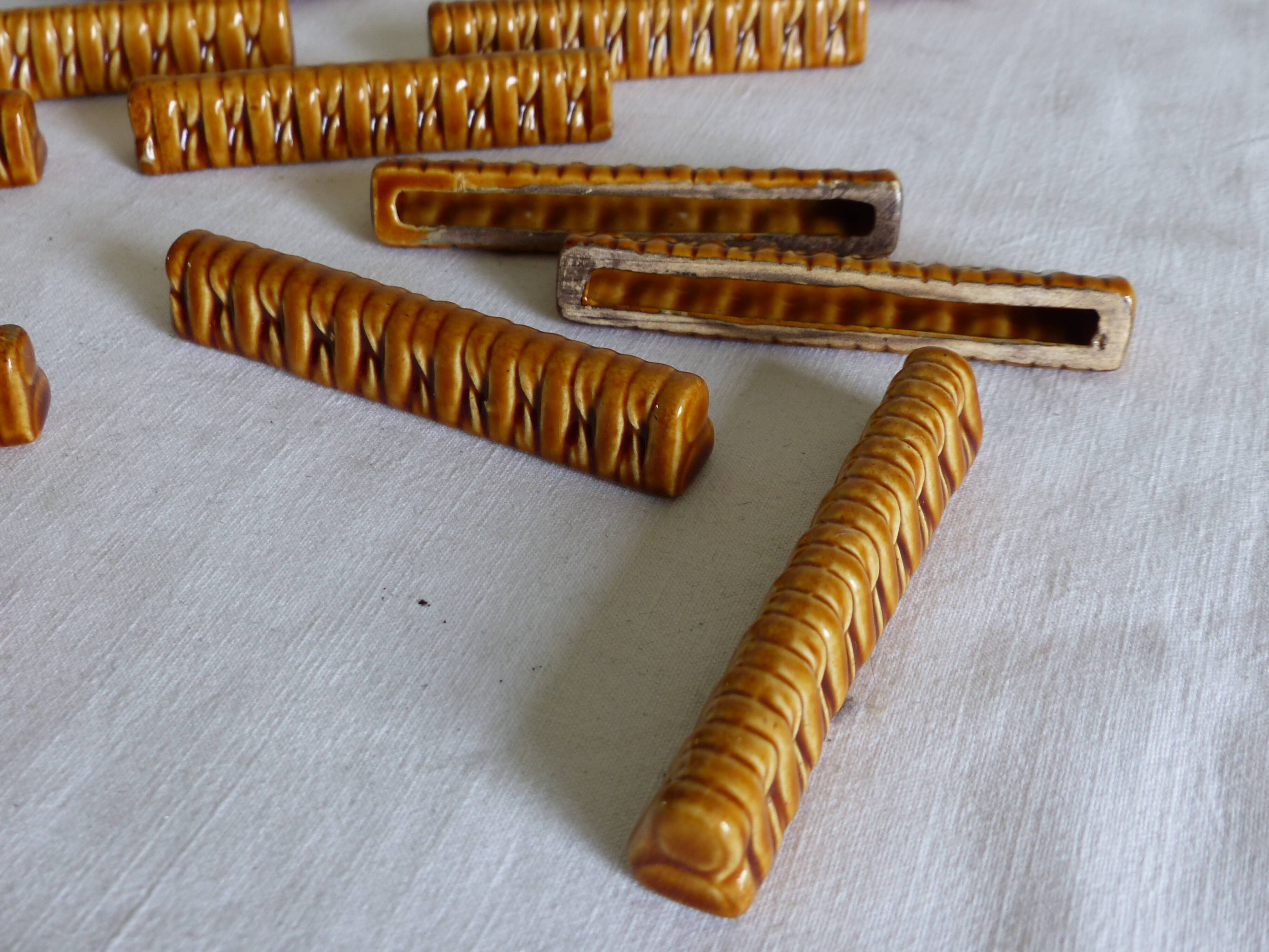 11 knife holders and 2 bottle coasters in Gien earthenware