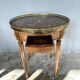 Hot water bottle table with a marble top and a brass gallery.