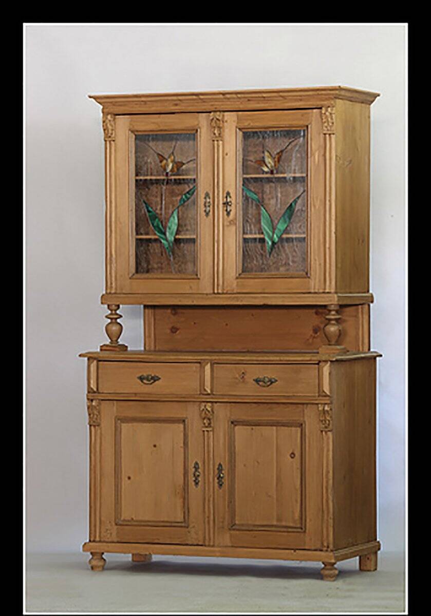 Brown pine kitchen cabinet with floral stained glass, 1920s vintage style.