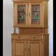 Brown pine kitchen cabinet with floral stained glass, 1920s vintage style.