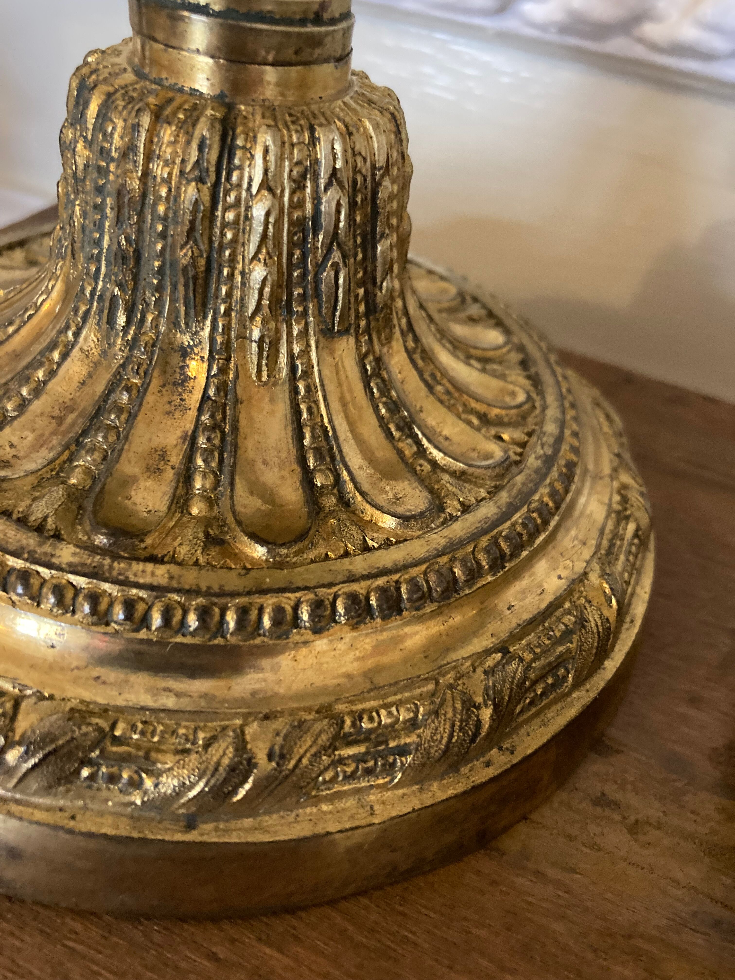 Pair of Louis XVI torch candlesticks in gilded bronze