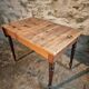 Vintage French pine table with extendable side, circa 1930, suitable for kitchen or office use.