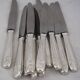 12 dessert, cheese, and hors d'oeuvre knives Grand Prix, Art Deco in silver-plated metal.
