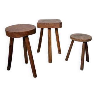 Set of three tripod oak stools in free forms.