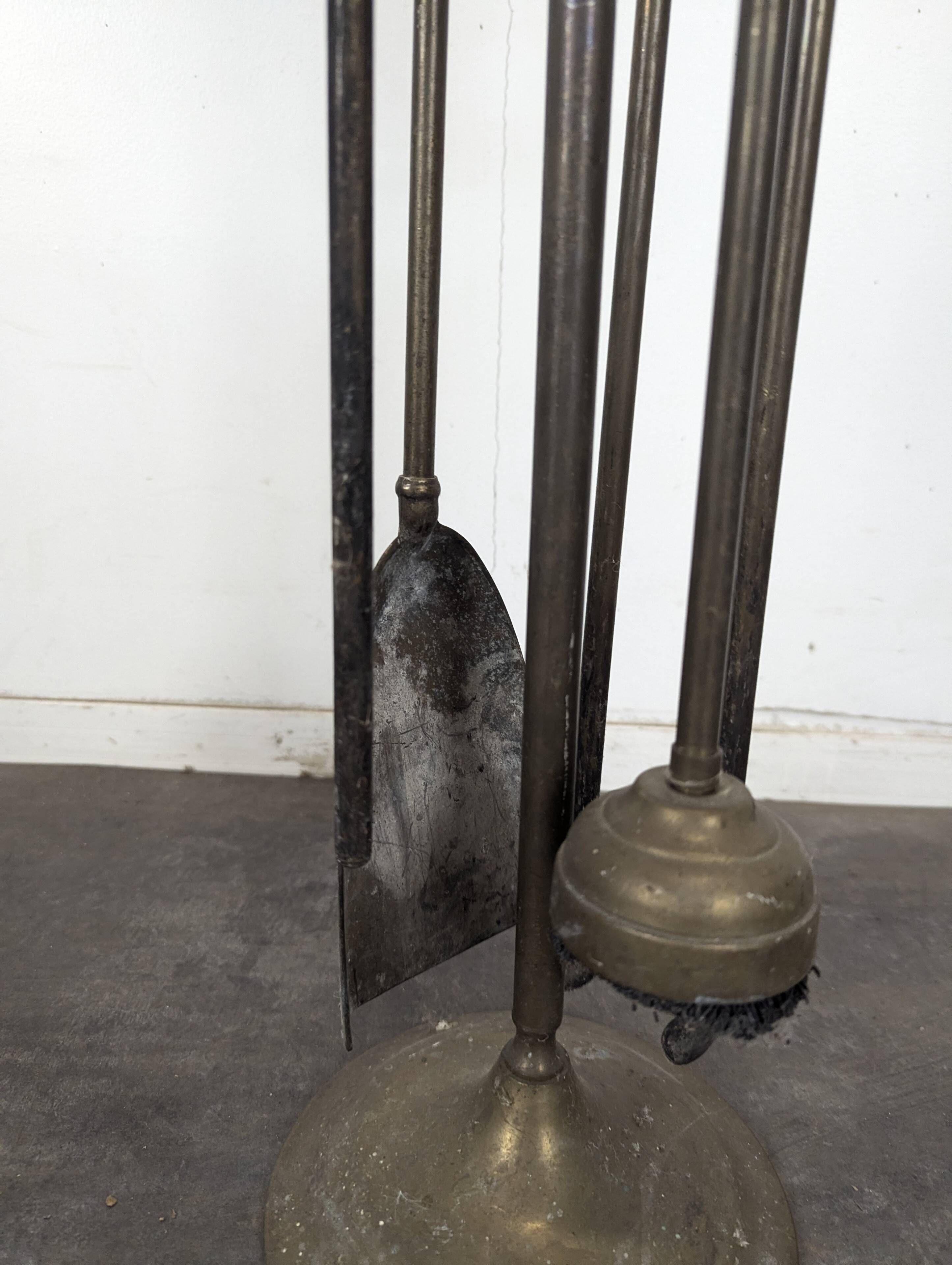 Brass fireplace tool set with four accessories
