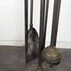Brass fireplace tool set with four accessories