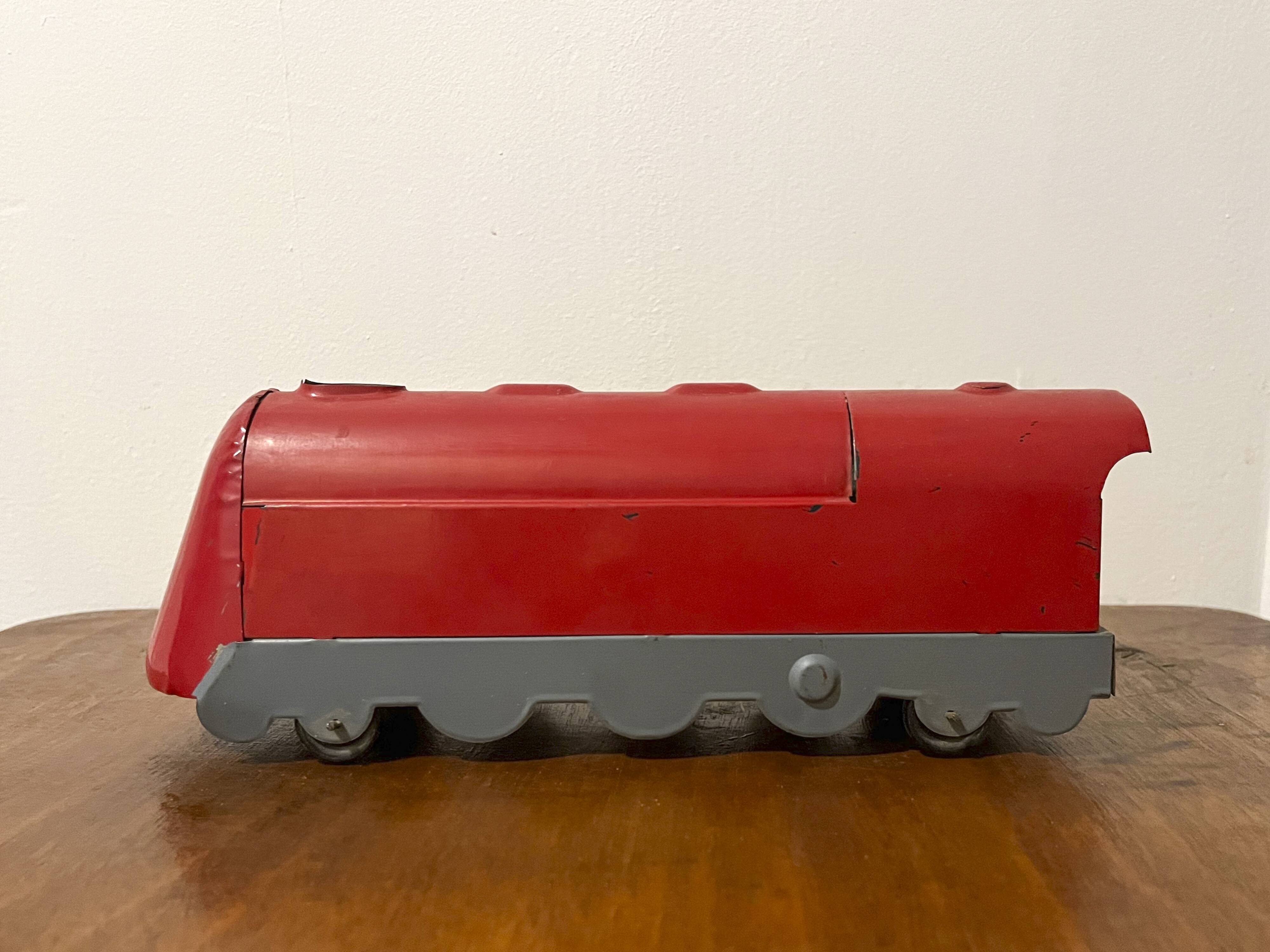 Red sheet metal locomotive 60s