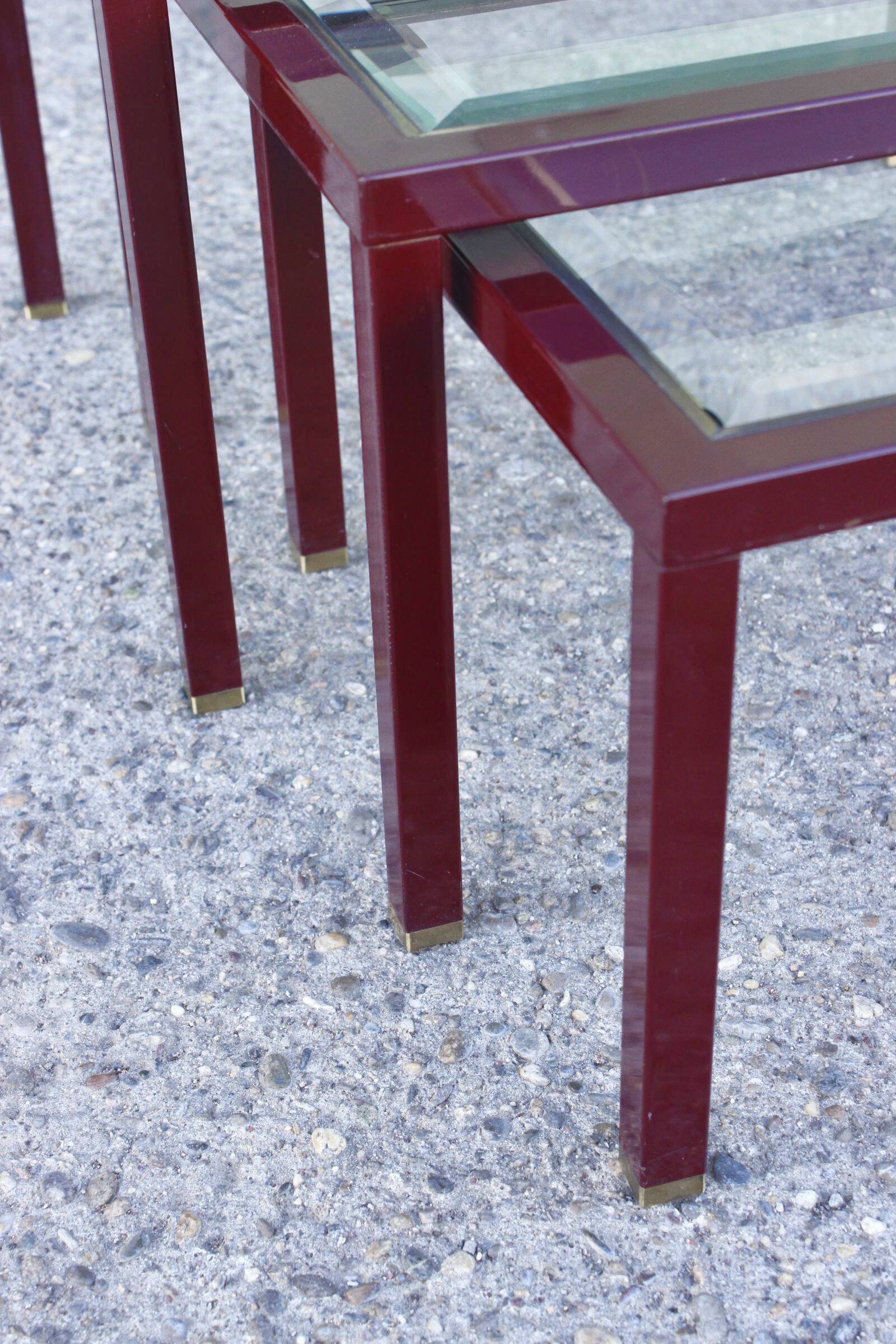 Nesting tables in burgundy lacquered metal and brass, France 1950s