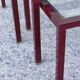 Nesting tables in burgundy lacquered metal and brass, France 1950s