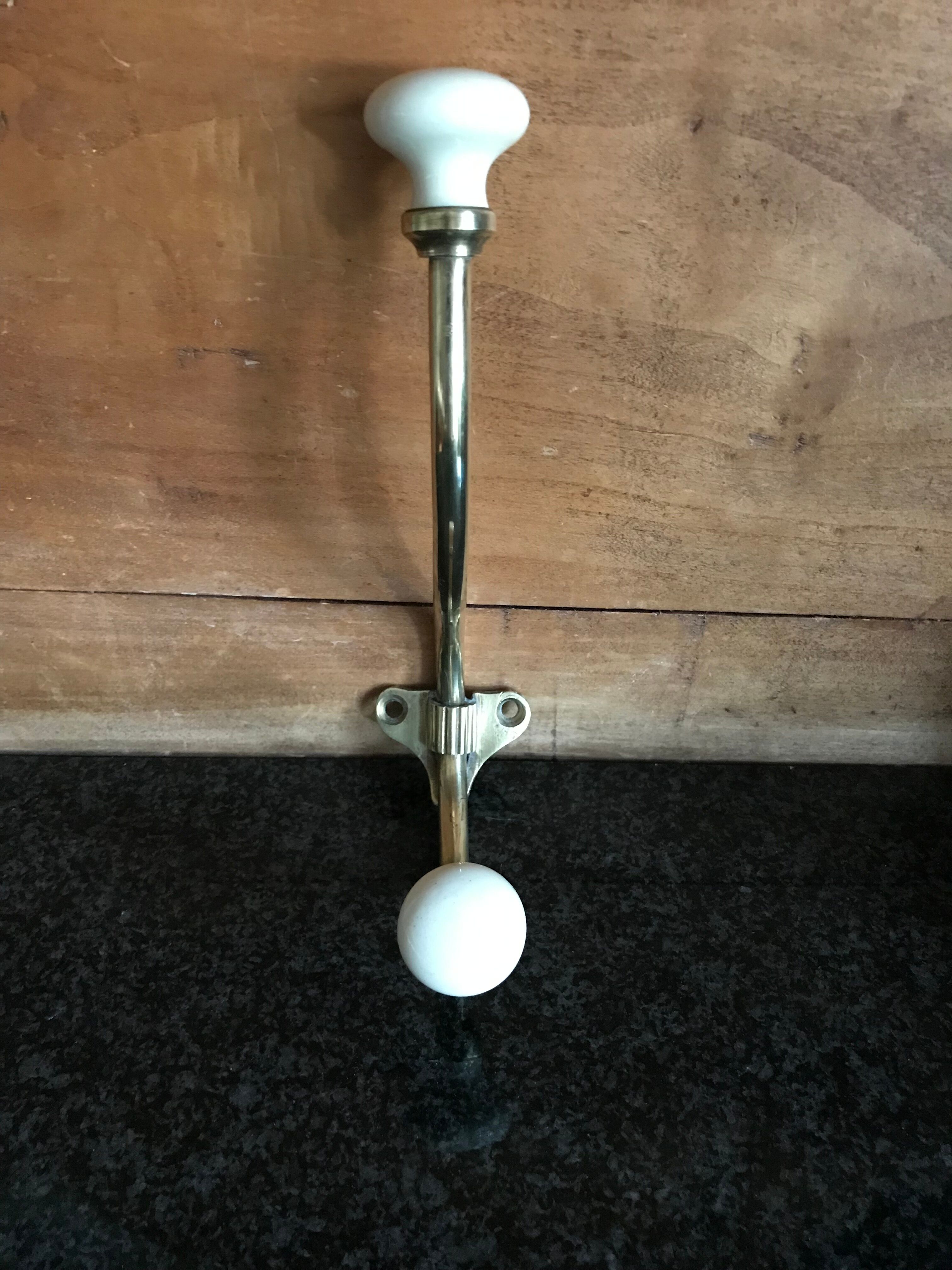 Brass and porcelain hook
