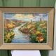 Colorful landscape painting with a river and hills signed Benjam