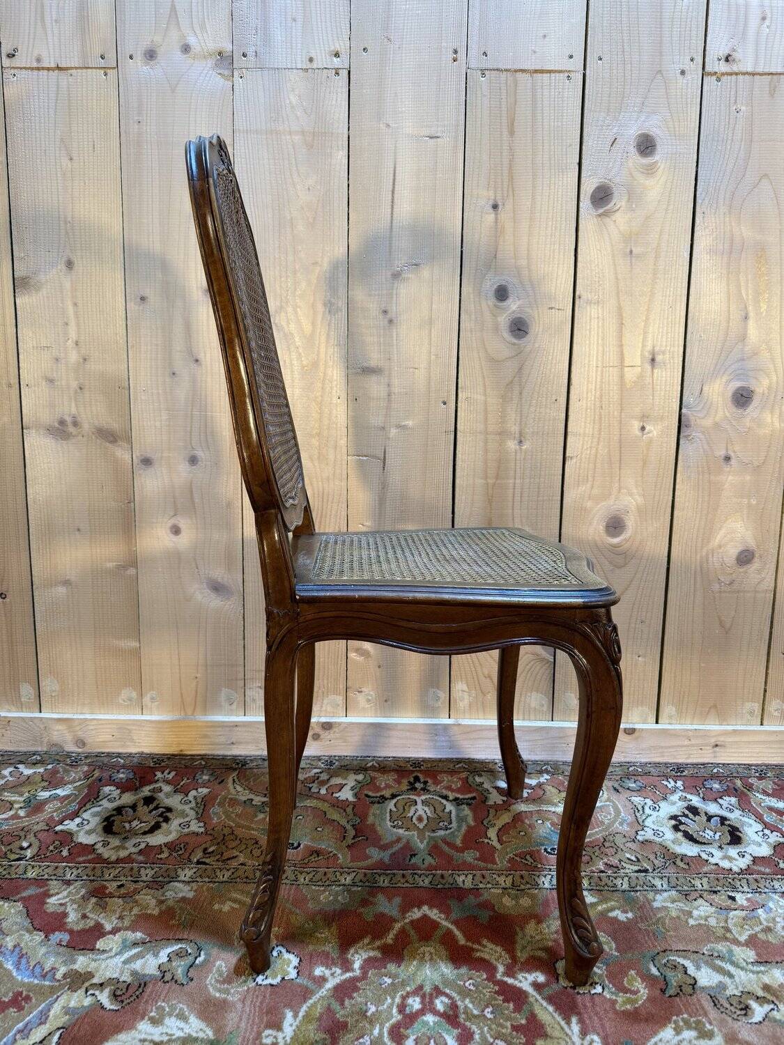 Set of 10 Louis XV style chairs in walnut and cane.