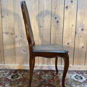 Set of 10 Louis XV style chairs in walnut and cane.