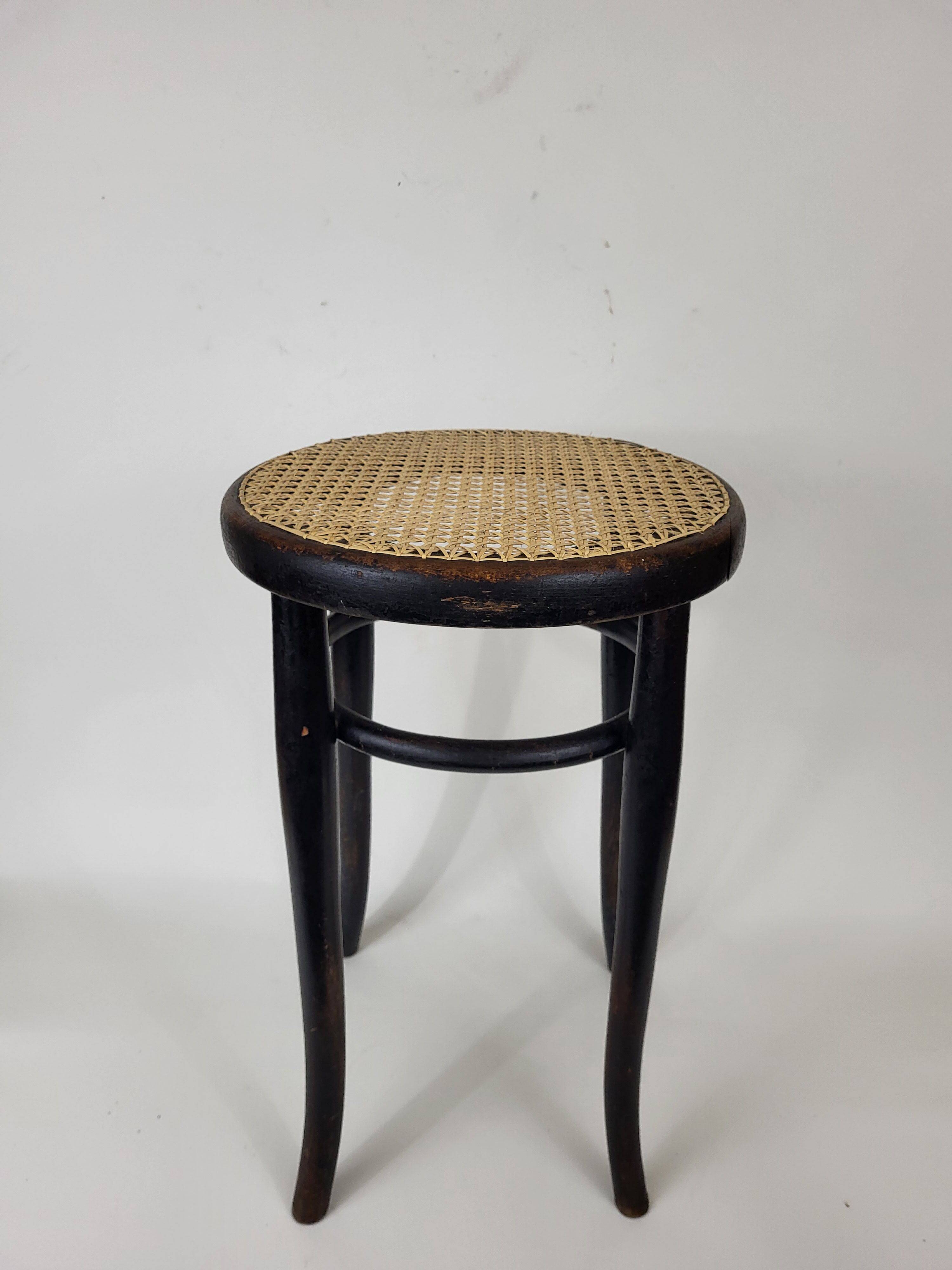 Blackened curved wooden stool Thonet