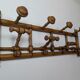 Wall-mounted coat rack made of turned wood