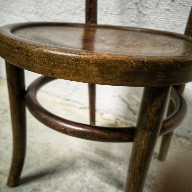 Antique children's chair in curved wood