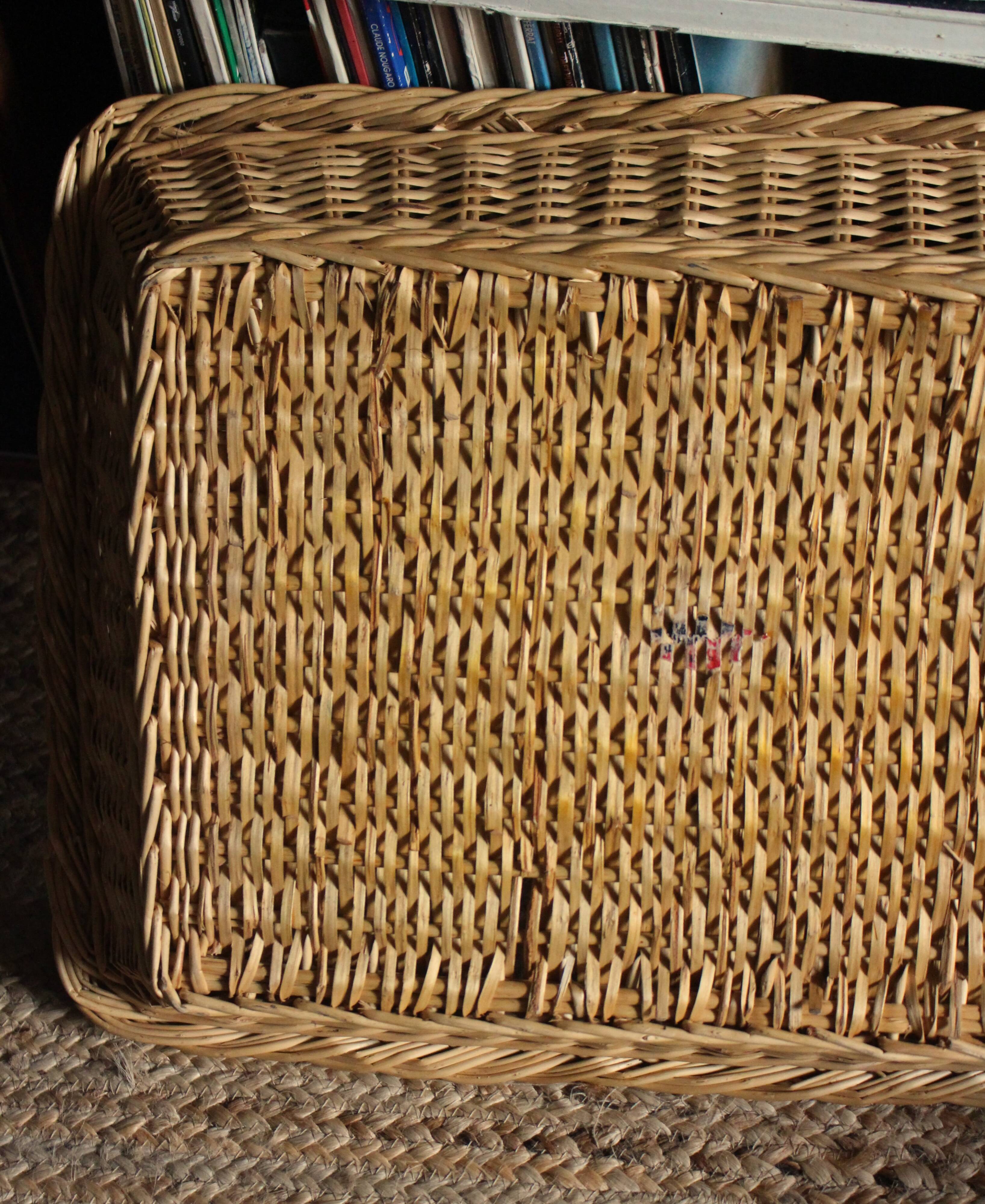 A large vintage rectangular wicker basket