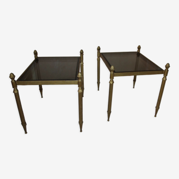 Pair of end of sofa bedside tables brass smoked glass
