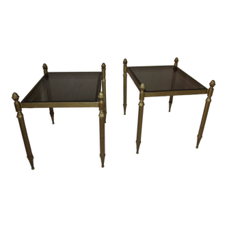 Pair of end of sofa bedside tables brass smoked glass