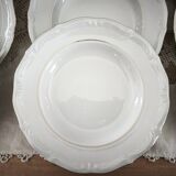 12 deep plates in porcelain with double gold trim.